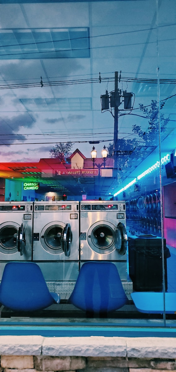 front load washing machines near building during night time