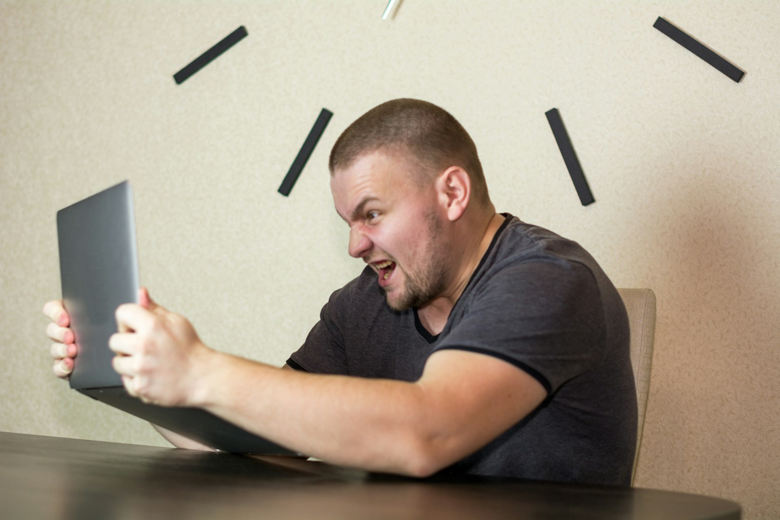 a man sitting in front of a laptop computer