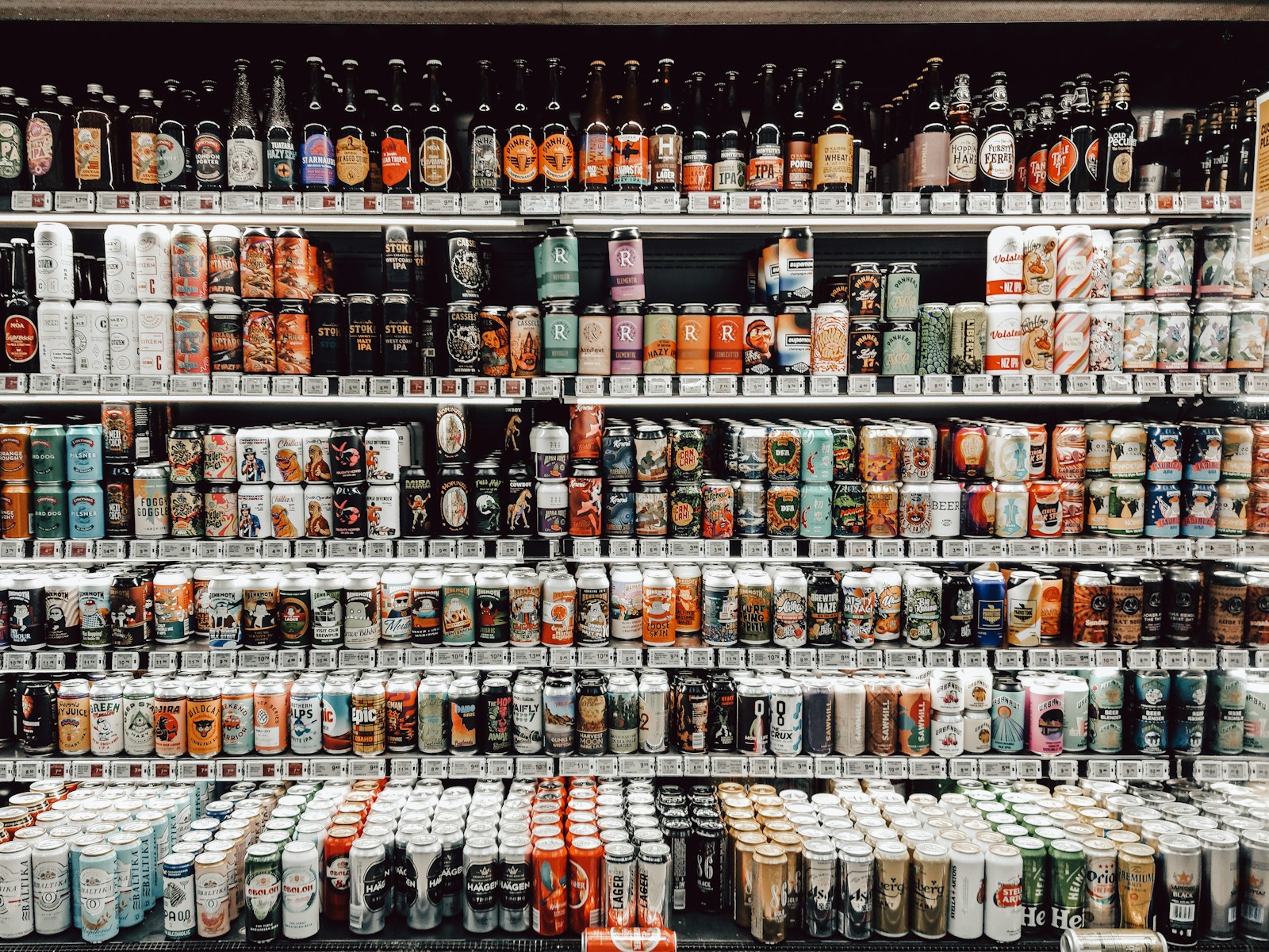 assorted bottles on brown wooden shelf- Liquor Store for Sale Opportunities